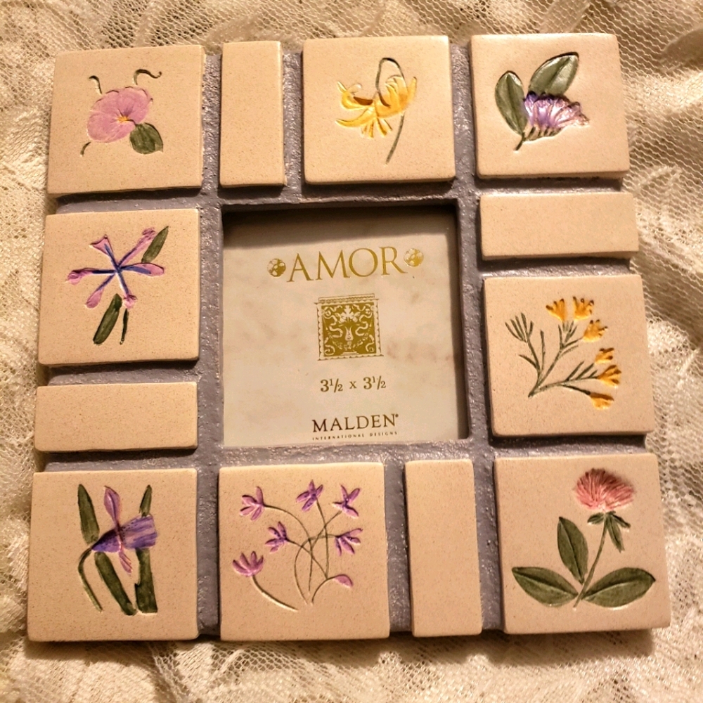 Handpainted ceramic frame.